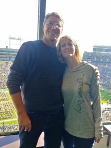 Chris Dooley with his wife Holly Dooley in Green Bay Wisconsin at Packer football at Lambeau field.
