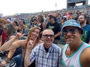 Kyle Yudes with two friends at Rockfest in Cadott Wisconsin