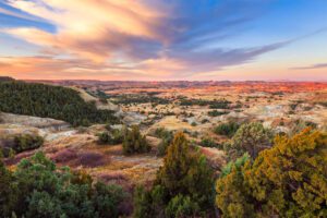 Sun setting on limestone mountains in Theodore Roosevelt National Park in North Dakota.