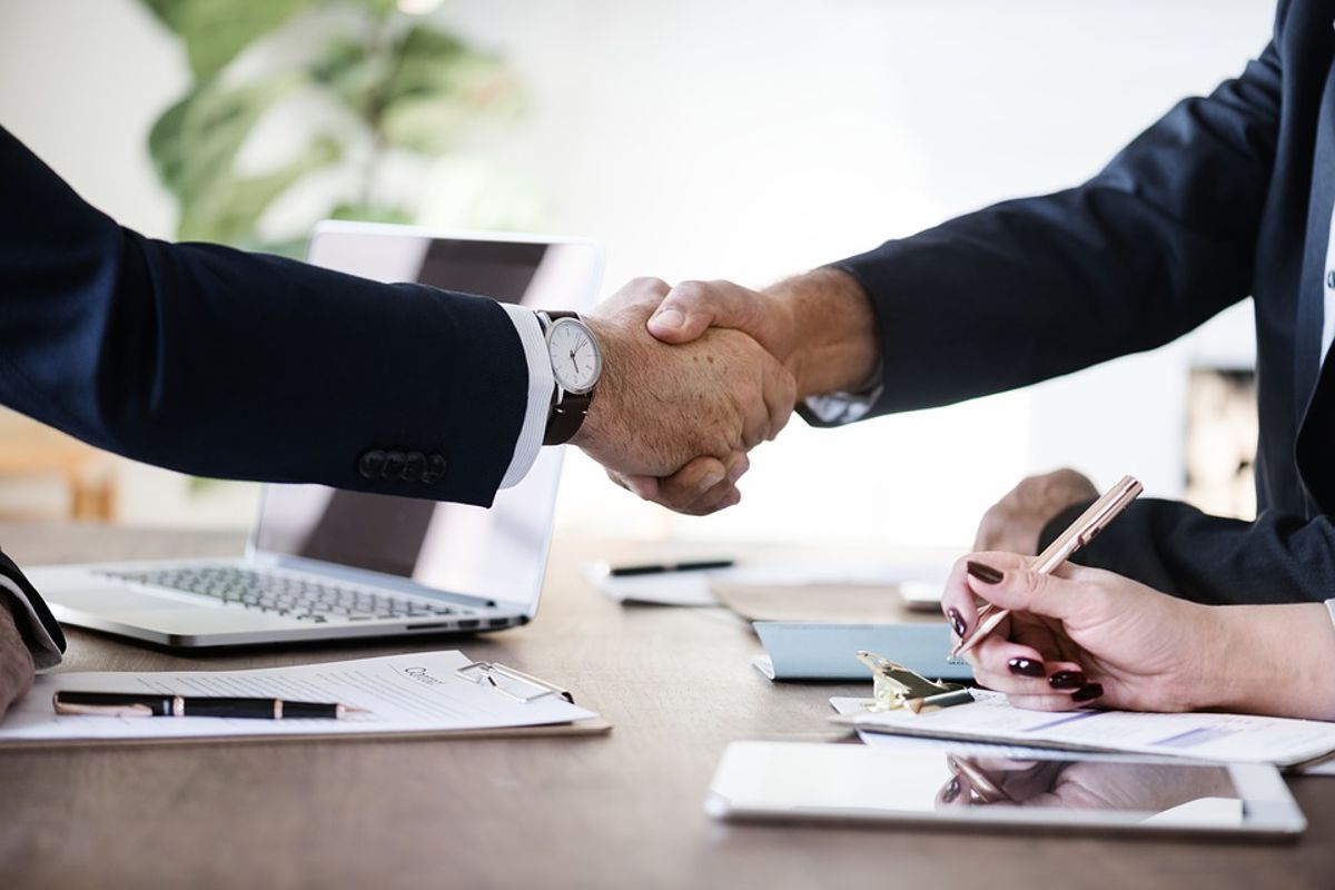 two businessmen shaking hands